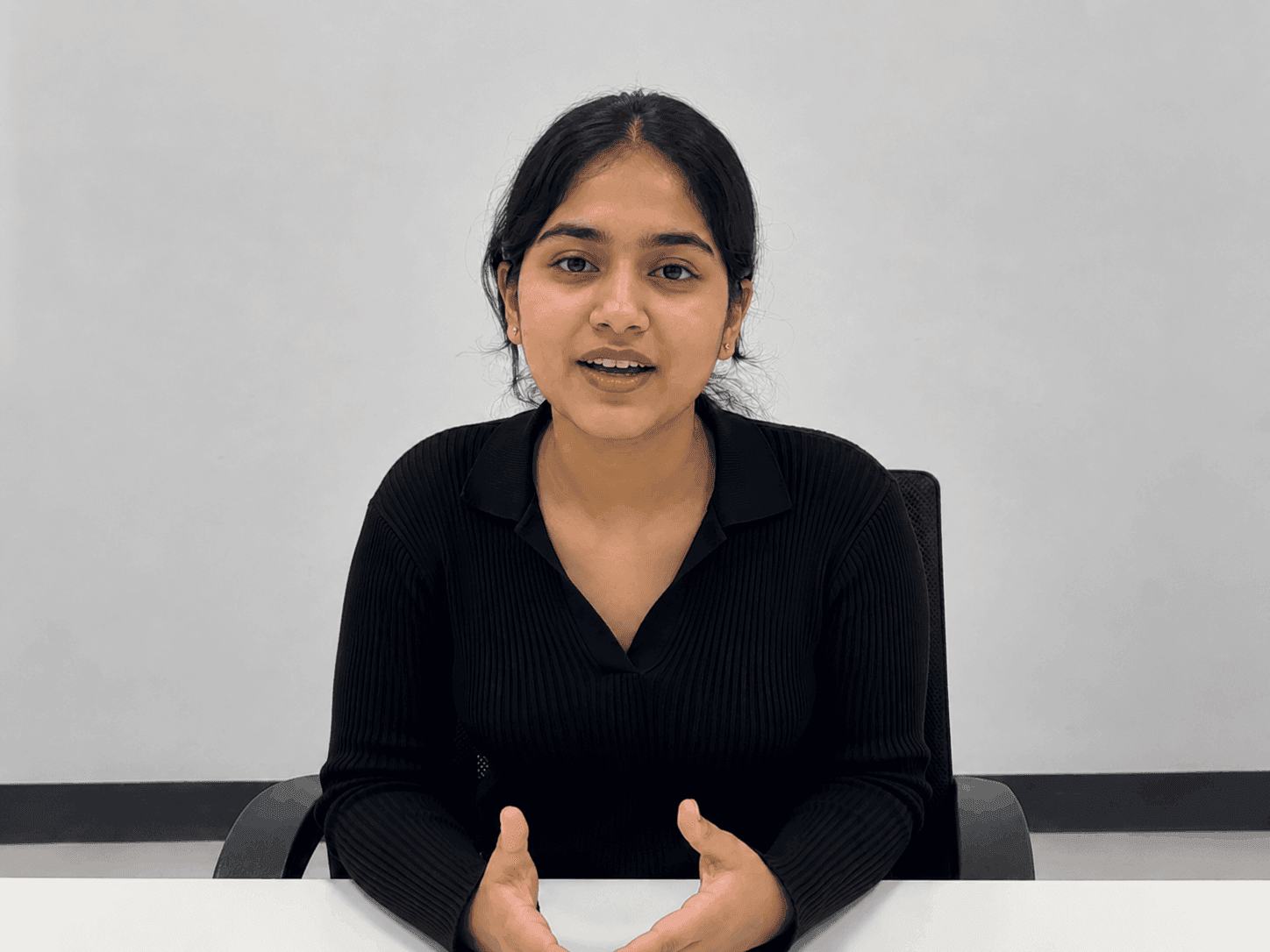 A candidate speaking with the AI examiner on a live video call